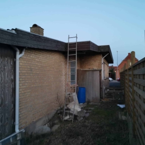 Renovering af facade og tagudhæng på murstenshus